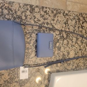 Kate spade crossbody purse and matching bifold wallet blue in color